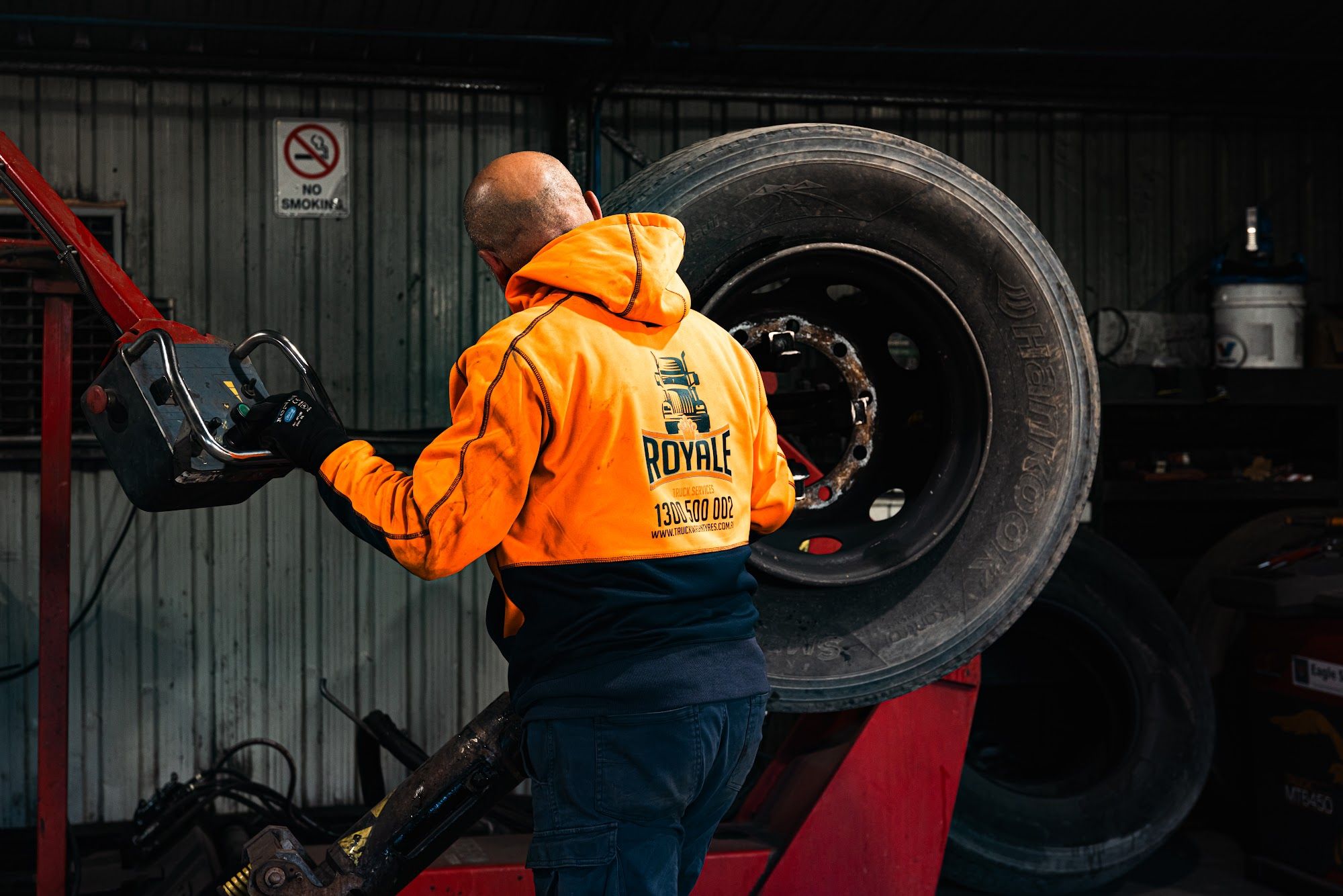 Royale technician repairing a truck tyre